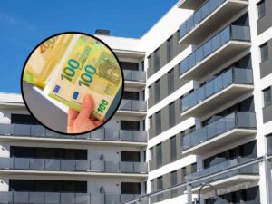 sfondo palazzo condominio e tondo con banconote 100 euro